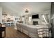 Open living room, kitchen, and dining area with light floors at 1844 Giana Ln, Monroe, NC 28112