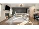 Spacious living room with fireplace, sectional sofa, and large TV at 1844 Giana Ln, Monroe, NC 28112