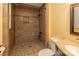 Bathroom with fully tiled standing shower and glass-doored window for natural light at 206 Fox Den Rd, Troy, NC 27371