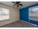 Small bedroom with carpeted floor and natural light from two windows at 206 Fox Den Rd, Troy, NC 27371