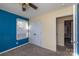 Small bedroom with blue accent wall and closet space at 206 Fox Den Rd, Troy, NC 27371