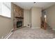 Cozy living room features a stone fireplace and a staircase leading to the next level at 206 Fox Den Rd, Troy, NC 27371