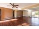 Bright living room featuring hardwood floors, natural light, and an open layout at 206 Fox Den Rd, Troy, NC 27371