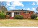 Brick ranch house with front yard, steps and shrubs at 2504 Juniper Dr, Charlotte, NC 28269