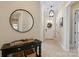 Bright entryway with tile floor, circular mirror and wicker baskets at 274 Hemlock Bluff Ct, Denver, NC 28037