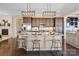 Open concept kitchen with an island, hardwood floors, and stainless steel appliances at 274 Hemlock Bluff Ct, Denver, NC 28037