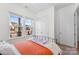 Bedroom with double windows, orange bedding, and a metal frame bed at 320 Northgate Blvd, Indian Trail, NC 28079