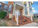 Brick steps leading to a white front door with sidelights and a welcoming mat at 3297 Su San Farms Rd, Gastonia, NC 28056