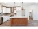 Modern kitchen with white cabinets, brick backsplash, and large island at 350 White Jenkins Rd, Bessemer City, NC 28016