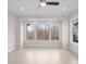 Large, naturally lit bedroom with multiple windows and neutral tones at 4774 Looking Glass Trl, Denver, NC 28037