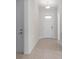 Bright foyer featuring tile flooring and a solid front door with glass accents at 4774 Looking Glass Trl, Denver, NC 28037