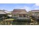 Back of house features a patio, fenced yard and a green lawn at 4774 Looking Glass Trl, Denver, NC 28037