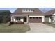 Charming single-Gathering home with a well-maintained lawn and attached two-car garage at 4774 Looking Glass Trl, Denver, NC 28037