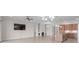 Open-concept living room connects to the kitchen and features a modern fireplace at 4774 Looking Glass Trl, Denver, NC 28037