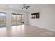 Bright, airy living room has large windows with access to the outdoor patio at 4774 Looking Glass Trl, Denver, NC 28037
