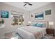 Inviting bedroom featuring a sun-filled window, plush bed, and decorative accents at 4774 Looking Glass Trl, Denver, NC 28037