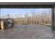 Spacious outdoor patio features a built-in grill and iron railing for entertaining at 4774 Looking Glass Trl, Denver, NC 28037