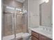Tiled walk-in shower with glass door, rain shower head, and hand-held shower at 4774 Looking Glass Trl, Denver, NC 28037