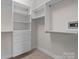 Organized walk-in closet with shelving, drawers, and safe for secure storage at 4774 Looking Glass Trl, Denver, NC 28037