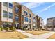 Front view of townhouses with landscaping and sidewalk at 513 Nantahala Dr, Charlotte, NC 28211