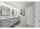 Double vanity bathroom with granite countertops and updated fixtures at 5259 Sweet Fig Way, Fort Mill, SC 29715