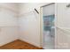 Large walk-in closet with wire shelving and access to bathroom at 5403 Shoreview Dr, Concord, NC 28025