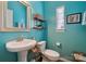 Small teal bathroom with pedestal sink and toilet at 5430 Allison Ln, Charlotte, NC 28277