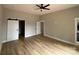 Bright bedroom with hardwood floors, a ceiling fan, and a closet at 5743 Selkirk Dr, Hickory, NC 28601