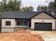 Charming single-story home with a two-car garage, neutral siding, and well-maintained landscaping at 5743 Selkirk Dr, Hickory, NC 28601