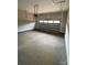 An empty two car garage with an automatic door opener at 5743 Selkirk Dr, Hickory, NC 28601