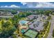 Stunning aerial view of community clubhouse, pool, and tennis courts surrounded by lush greenery at 5981 Bison Ct, Fort Mill, SC 29707