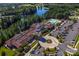 Aerial view of a resort-style community with a pool, clubhouse, and manicured landscaping at 5981 Bison Ct, Fort Mill, SC 29707