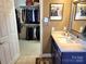 Bathroom with a walk-in closet and a vanity with ample countertop space at 5981 Bison Ct, Fort Mill, SC 29707