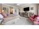 This bedroom offers a large television, ceiling fan and ensuite bathroom access at 5981 Bison Ct, Fort Mill, SC 29707