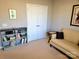 Cozy bedroom with a comfortable sofa and built-in bookcase for storage and display at 5981 Bison Ct, Fort Mill, SC 29707