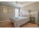 Comfortable bedroom with a white tufted headboard and neutral walls at 5981 Bison Ct, Fort Mill, SC 29707