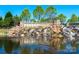 Stone sign at Sun City Carolina Lakes community featuring cascading waterfalls at 5981 Bison Ct, Fort Mill, SC 29707