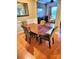 Traditional dining room featuring a wood table, four upholstered chairs, and wainscoting at 5981 Bison Ct, Fort Mill, SC 29707