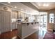 Spacious kitchen featuring a breakfast bar and hardwood floors at 5981 Bison Ct, Fort Mill, SC 29707