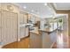 Well-equipped kitchen with stainless steel appliances, ample cabinetry, and a breakfast bar overlooking the dining area at 5981 Bison Ct, Fort Mill, SC 29707