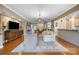 Spacious living room with a large TV, comfortable seating, and an open floor plan at 5981 Bison Ct, Fort Mill, SC 29707