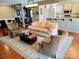 Comfortable living room with neutral tones, a decorative rug, and open access to the kitchen area at 5981 Bison Ct, Fort Mill, SC 29707