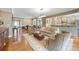 Inviting living room with open floor plan, seamlessly connecting to the dining area and kitchen at 5981 Bison Ct, Fort Mill, SC 29707