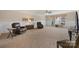 Expansive living room with neutral walls, carpeted flooring, a ceiling fan, and comfortable seating arrangements at 5981 Bison Ct, Fort Mill, SC 29707