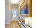 Bright and airy entryway with hardwood floors and large artwork at 602 Compass Dr, Denver, NC 28037