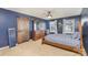 Bedroom with barn door, ceiling fan, and wooden dresser at 619 Samet St, Fort Mill, SC 29715