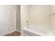 Bright bathroom featuring a soaking tub with a shower, and a tiled shower stall at 6204 Springbeauty Dr, Charlotte, NC 28227