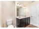 Bathroom featuring double sink vanity, large mirror, and modern fixtures at 6204 Springbeauty Dr, Charlotte, NC 28227