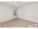 Bedroom featuring carpet flooring, a window with blinds, and neutral paint at 6204 Springbeauty Dr, Charlotte, NC 28227