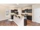 The kitchen showcases dark cabinets, granite countertops, and stainless steel appliances at 6204 Springbeauty Dr, Charlotte, NC 28227